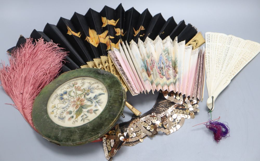 An 18th century circular framed embroidery, worked with chenille and pearls, a brise fan, two other fans, a 1930s sequin collar and an